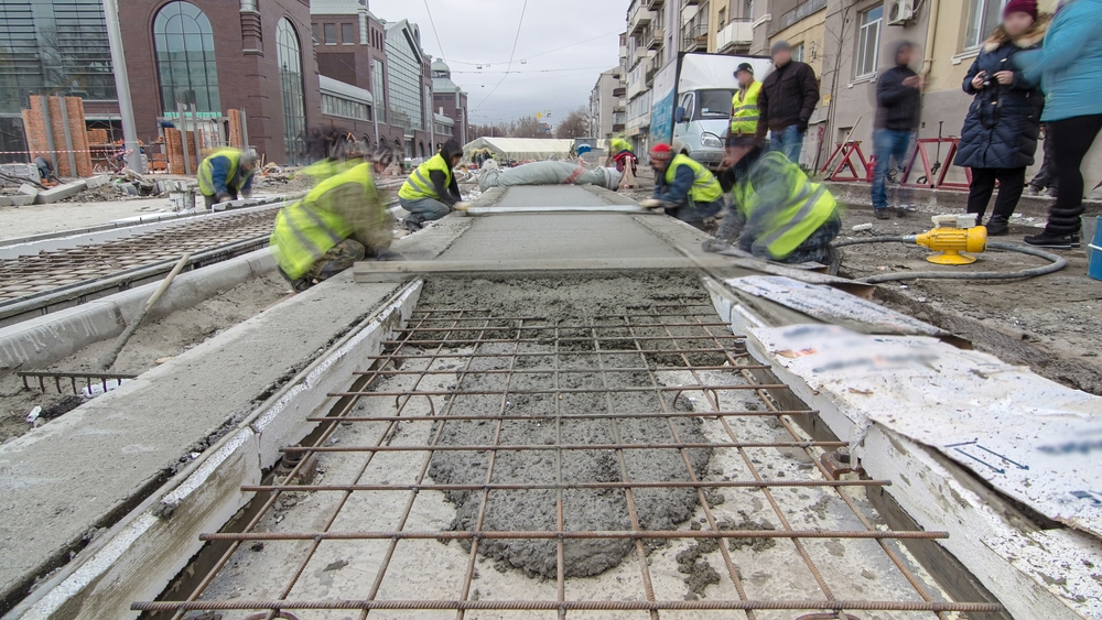 Pouring,Ready-mixed,Concrete,After,Placing,Steel,Reinforcement,To,Make,The