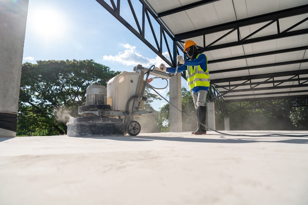 Construction,Worker,Using,Machine,Polishing,Surface,Floor,Smoothing,And,Finishing