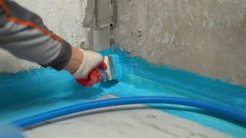 Construction,Worker,Waterproofing,Bathroom,Corner,Using,Blue,Liquid,Membrane,And