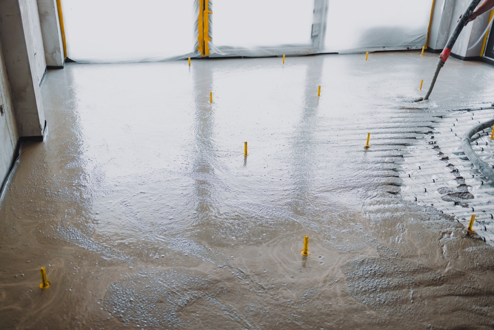Builders,Are,Pouring,Concrete,Mix,On,A,Floor,Using,A