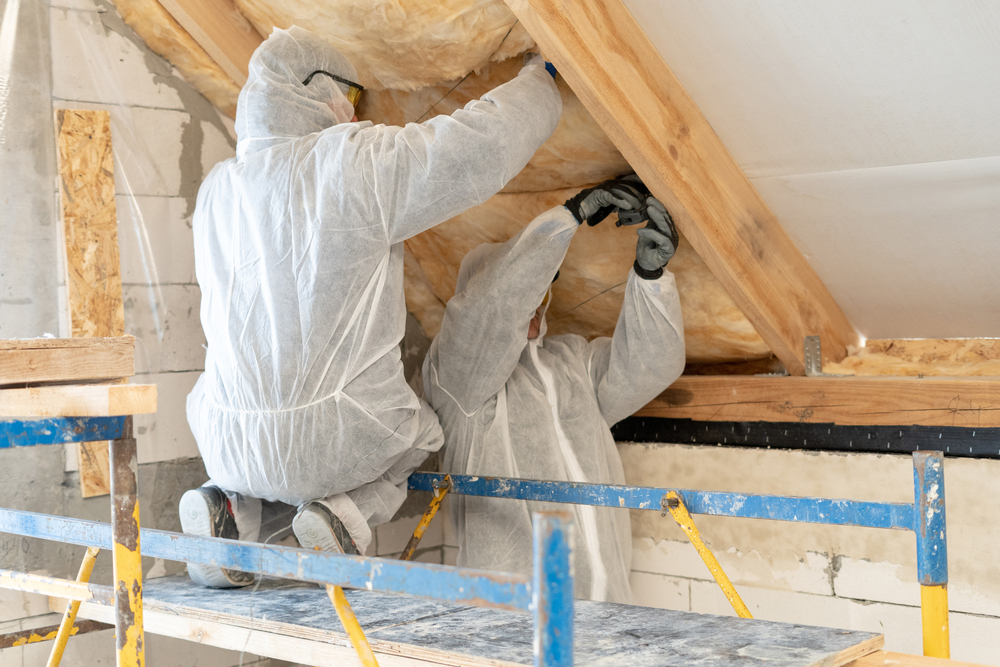 Back,View,Of,Two,Foreman,In,Overalls,Working,With,Rockwool