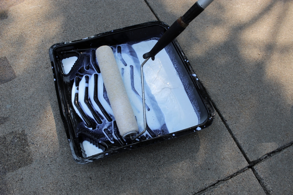 Closeup,Of,Roller,For,Being,Used,For,Concrete,Driveway,Sealing