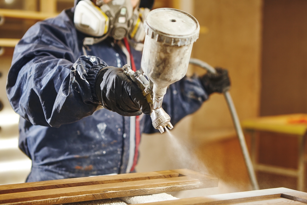 Staining,Wood,With,White,Spray,Gun.,Application,Of,Flame,Retardant