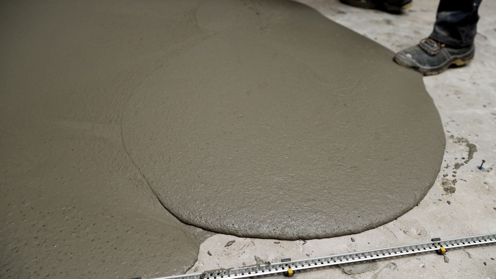Professional,Construction,Workers,Carefully,Leveling,Wet,Concrete,Mix,,Creating,Smooth