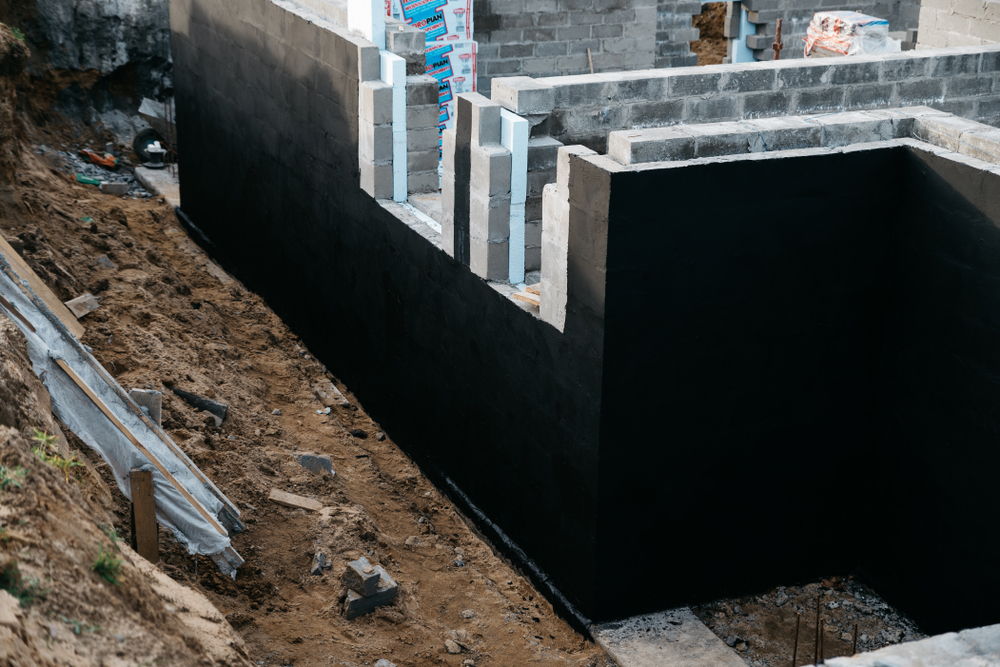 Basement waterproofing involves techniques and materials used to prevent water from penetrating the basement of a structure while providing additional safeguards against flooding.