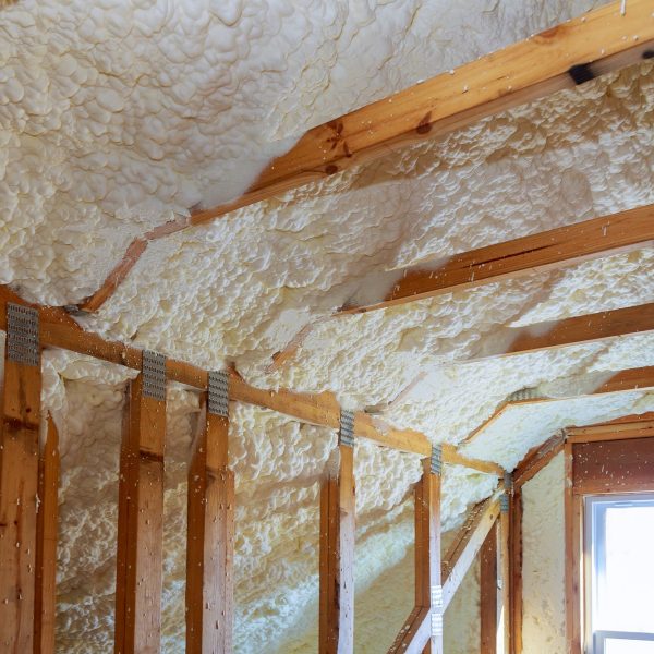 Closeup on termal insulation installing at the attic insulation of the house