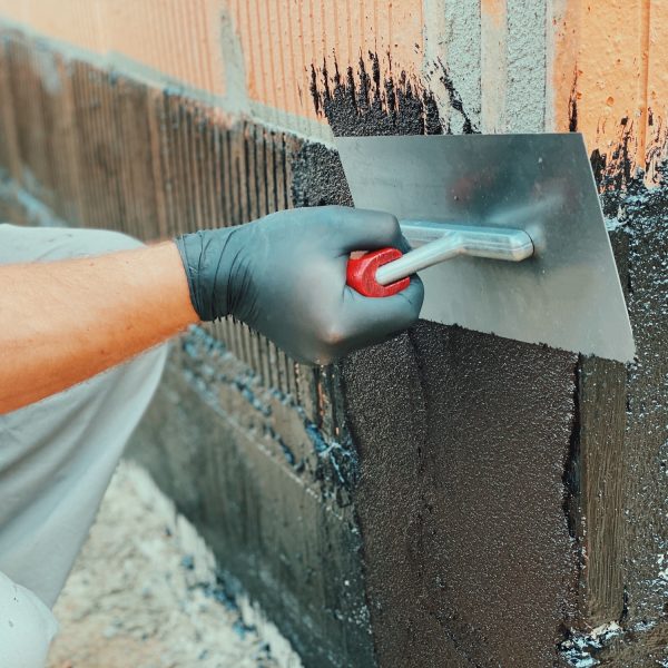 Coating hollow bricks
