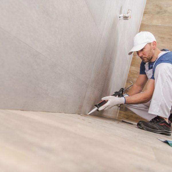 Worker Sealing Ceramic Tiles